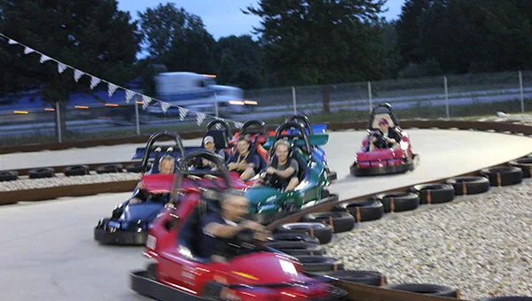 Go-karts racing on the 1,000-foot banked track
